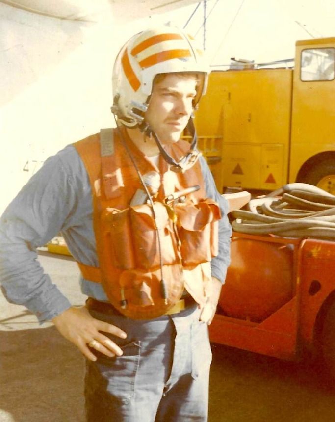 Craig A. Steele in a striped helmet and float vest