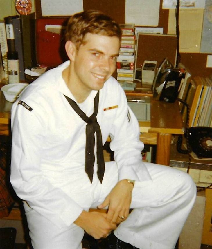 Craig A. Steele smiling in his Navy dress whites